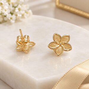 10K Gold Textured Flower Stud Earrings Description: Delicate 10K gold flower stud earrin